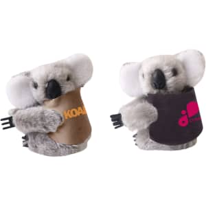 A cute grey plush koala toy with a coloured fabric pouch, featuring a logo. It has white ears and a friendly expression.