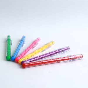 A collection of six puzzle maze pens in green, pink, yellow, purple, blue, and red, featuring transparent barrels.