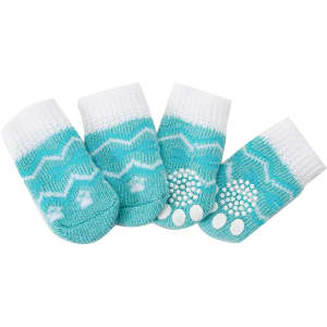 A set of four turquoise and white pet socks featuring a zigzag pattern and non-slip grips on the bottom.