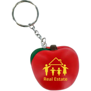 A red apple-shaped stress reliever keyring with a green leaf and a keychain attachment. It features a logo.