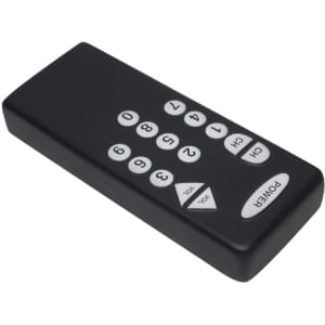 A black remote control-shaped stress reliever with white buttons and a logo on its surface.