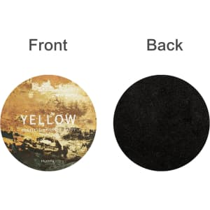 A round frosted metal coaster featuring a decorative front design in yellow tones and a plain black back.