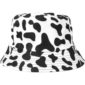 A cow print bucket hat featuring a white background with black spots. The hat has a wide brim and a simple design.