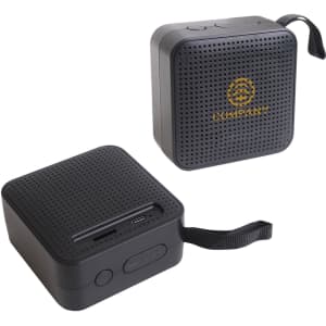 A portable wireless Bluetooth speaker in black with a textured surface and a branding logo on one side.