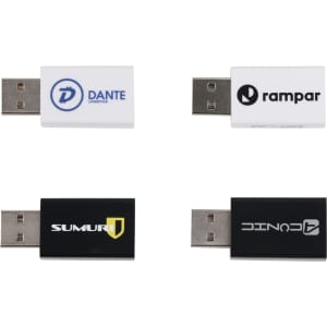 Four USB data blockers in white and black with various logos. They feature standard USB connectors.