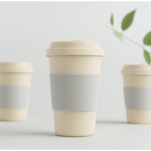 A drink bottle featuring a light beige bamboo fibre design with a grey silicone sleeve. It has a logo on the front.