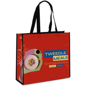 A red laminated non-woven trade show bag with black handles and a colourful design featuring a logo.