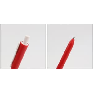 A red pen with a click mechanism and a pointed tip, featuring a clip and a logo.
