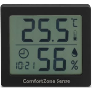A digital thermometer and hygrometer displaying temperature and humidity. The device has a black casing with a screen.