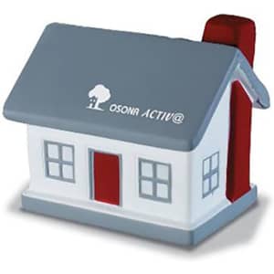 A house-shaped stress reliever in grey, white, and red, featuring a chimney and windows. Branding is present.