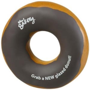 A donut-shaped stress reliever in brown and beige, featuring a logo and a playful design.