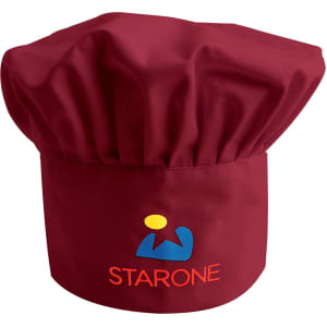 A maroon adult chef hat with a gathered top and a logo embroidered on the front.