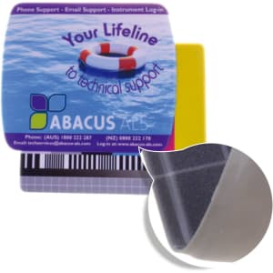 A mouse mat featuring a textured grey surface, with a yellow and branded section for added grip.