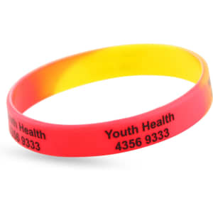 A colourful silicon wristband with a red and yellow gradient, featuring a logo and text.