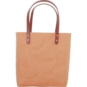 A washable kraft paper bag in a natural brown colour with brown PU handles. It features silver hardware accents.