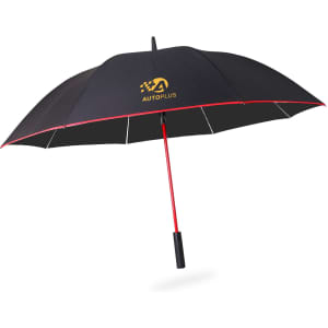 A black umbrella with a red handle and trim, featuring a logo on the canopy.