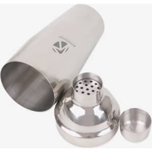 A stainless steel cocktail shaker set with a large shaker, strainer, and jigger, featuring a logo on the shaker.
