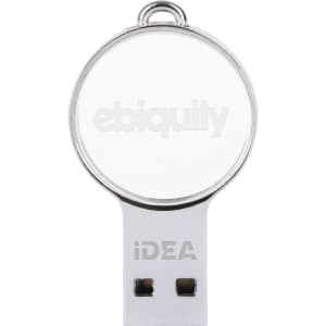 A mini round crystal flash drive in silver and clear, featuring a branding logo on its surface.