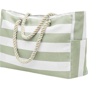 A green and white striped beach bag with rope handles and a side pocket. It has a logo on the side.