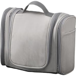 A grey travel storage bag with multiple compartments and zippers, featuring a sturdy handle on top.
