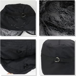 A thickened earflap hat in black with a soft grey lining and a fastening detail. Features a logo on the exterior.