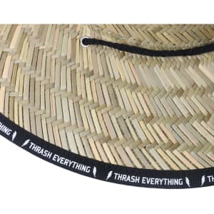 A straw hat with a wide brim and a black string, featuring a logo band around the base.
