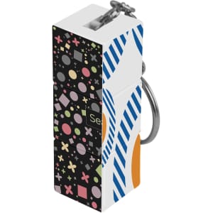 A custom square cube with keyrings featuring a colourful design of shapes and patterns, with a metallic keyring attachment.