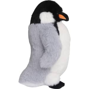 A plush toy penguin in grey and white, featuring an orange beak and a black head. It has a branding logo.