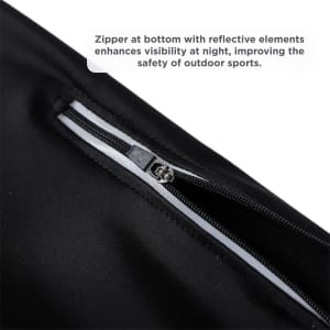 A close-up of black cycling tights featuring a zipper with reflective elements for enhanced visibility.