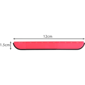A pink multifunctional tool with measuring markings, featuring a sleek design and a black edge.