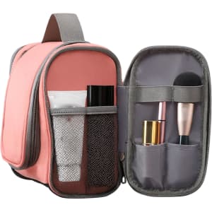 A pink travel storage bag with grey accents, featuring compartments for makeup and toiletries. It has a zip closure and a handle.