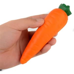 An orange carrot-shaped stress reliever held in a hand, featuring a green leafy top.
