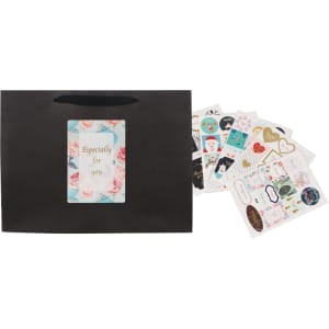 A medium black paper bag with a fabric flat handle, accompanied by a collection of decorative stickers.