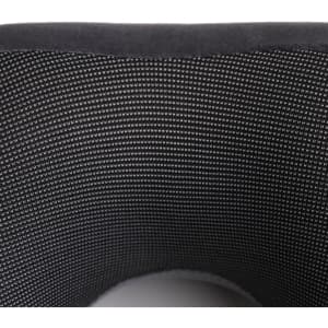 A U-shaped travel pillow in black with a soft, textured surface and mesh lining. Features branding on the exterior.