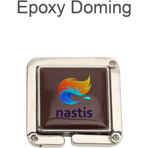 A square, foldable desk hook with a shiny silver finish and a coloured epoxy doming featuring a logo.