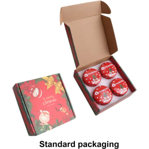 A set of four red tin candles in a festive box with holiday designs and a logo.