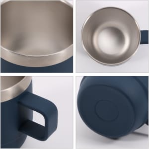 A stackable stainless steel mug in navy blue with a sleek silver rim and a handle. The interior is polished stainless steel.