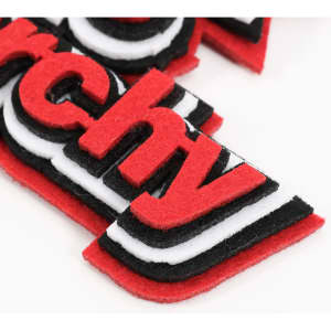 Custom felt logo hanging tags in red, black, and white, showcasing layered design elements without visible text.