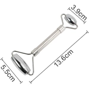 A stainless steel facial roller with two rounded ends, measuring 13.6 cm in length, on a white background.