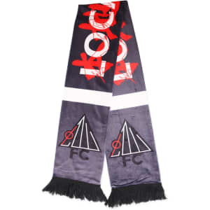A dark grey velvet scarf with red graphic elements and two black logos, featuring fringed ends.
