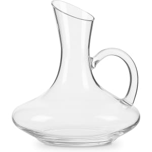 A clear glass wine decanter with a curved body and a handle, featuring a graceful spout at the top.