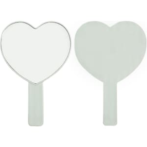 A heart-shaped handheld mirror with a silver handle. The mirror is reflective and features a smooth surface.