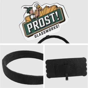 A black foam topper headband with a graphic design featuring a figure and text. The headband has a logo.