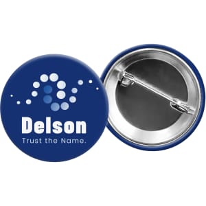A round button badge in navy blue with a silver backing, featuring a logo and graphic design.
