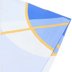 A close-up of a fabric corner featuring a blue and white design with yellow accents, showcasing vibrant colours and stitching.