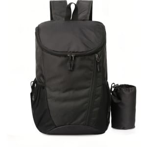 A packable travel backpack in black, featuring multiple compartments and a small pouch for storage.
