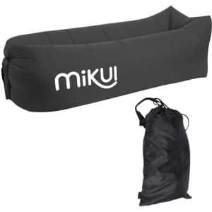 An inflatable lazy bed in black, accompanied by a matching storage bag. The product features a logo.