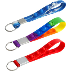 A set of four rubber popper stress reliever keyrings in blue, green, purple, yellow, and red with metal keyring attachments.