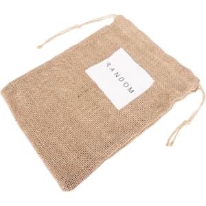 A jute net produce bag in natural brown with a white label and drawstring closure.