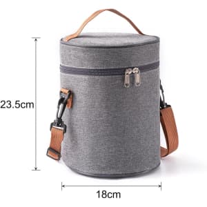 A cylindrical lunch bag in grey fabric, featuring a zip closure and a detachable shoulder strap. It has a handle for easy carrying.